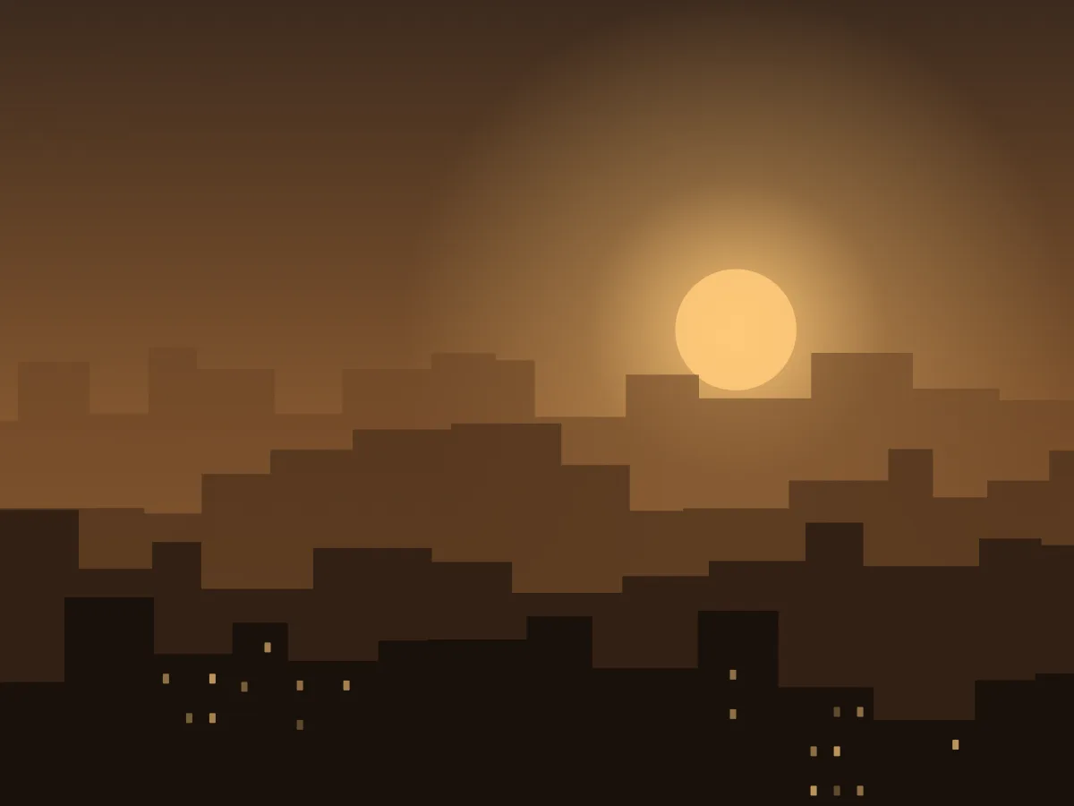 Low buildings silhouetted against a hazy city sunset