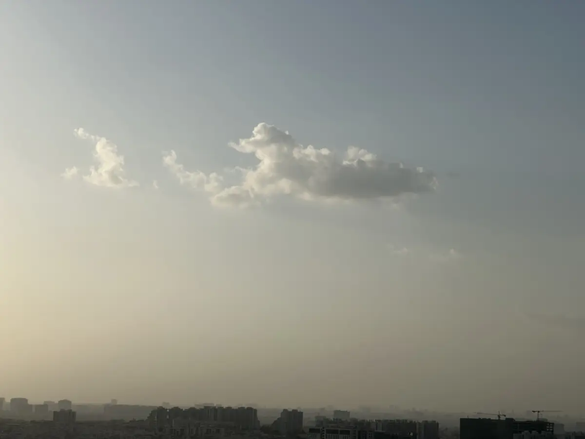 Pale haze flattening the city skyline